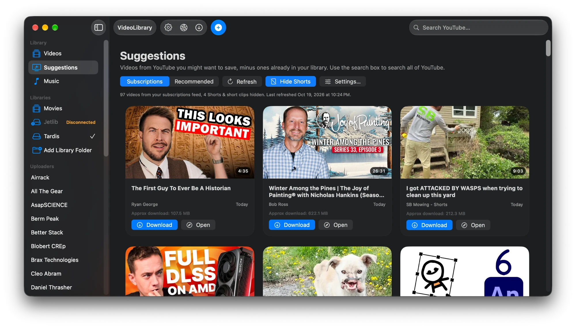 Suggestions: a grid of videos from the YouTube feed with download buttons.
